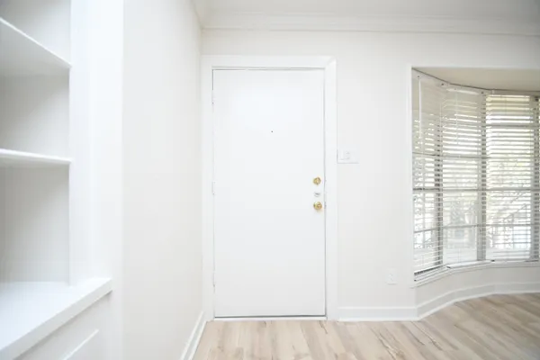 a view of a room that has a window in it