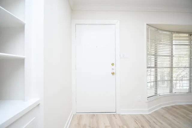a view of a room that has a window in it