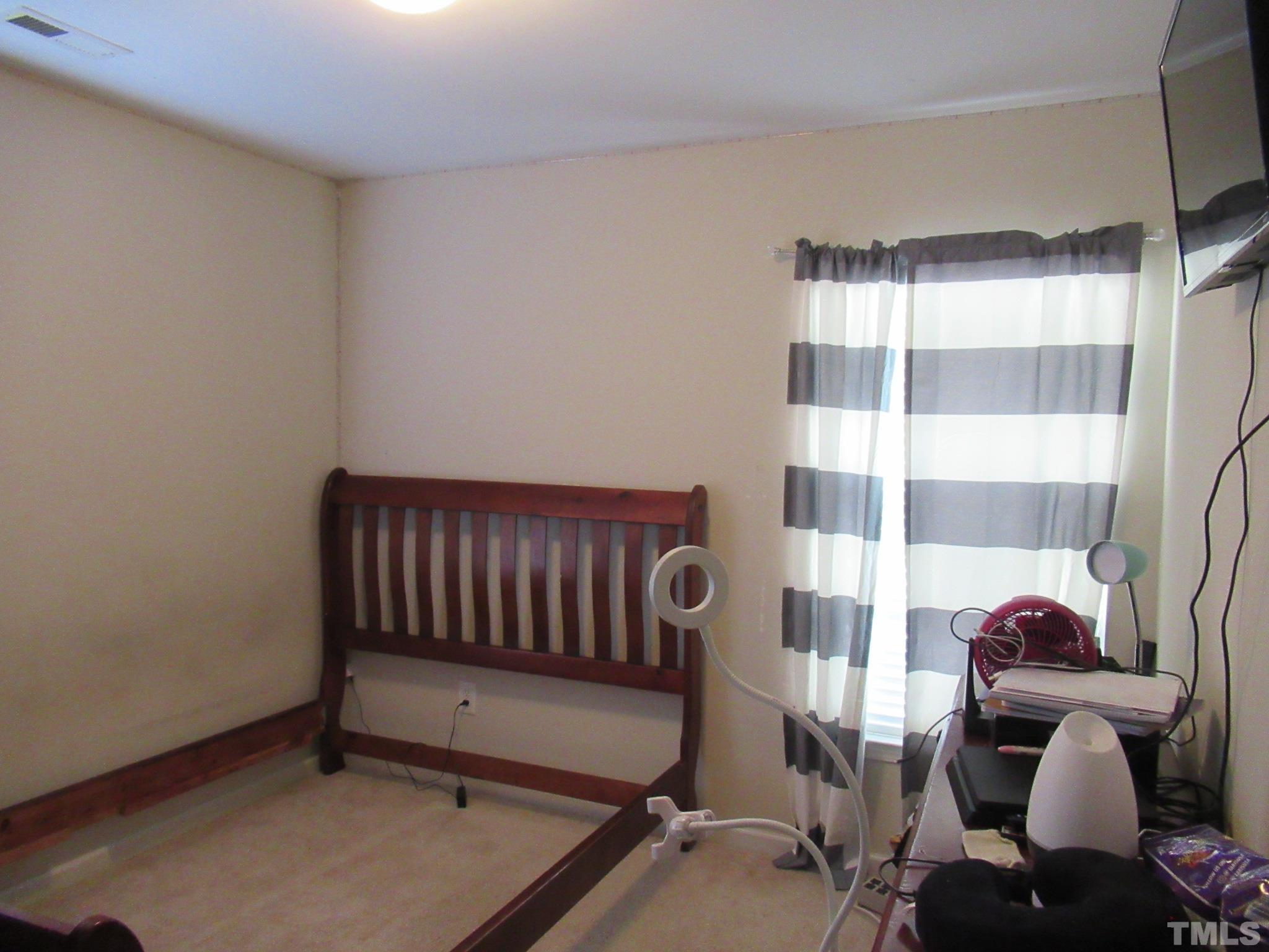 541 Ashgreen Court Rolesville, NC 27571 - Photo 11 of 15 a bedroom with furniture and a window