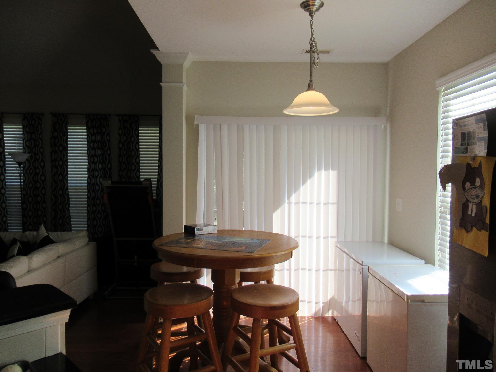 541 Ashgreen Court Rolesville, NC 27571 - Photo 5 of 15 a room with a table and chairs