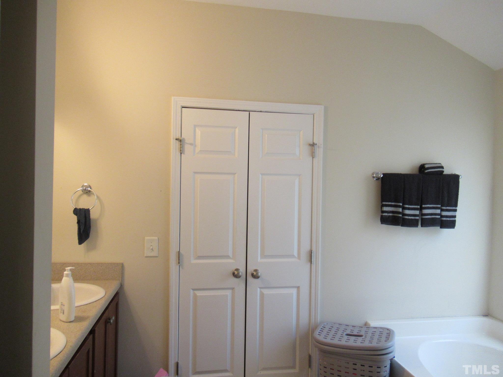 541 Ashgreen Court Rolesville, NC 27571 - Photo 9 of 15 a bathroom with a sink a toilet a shower and a mirror