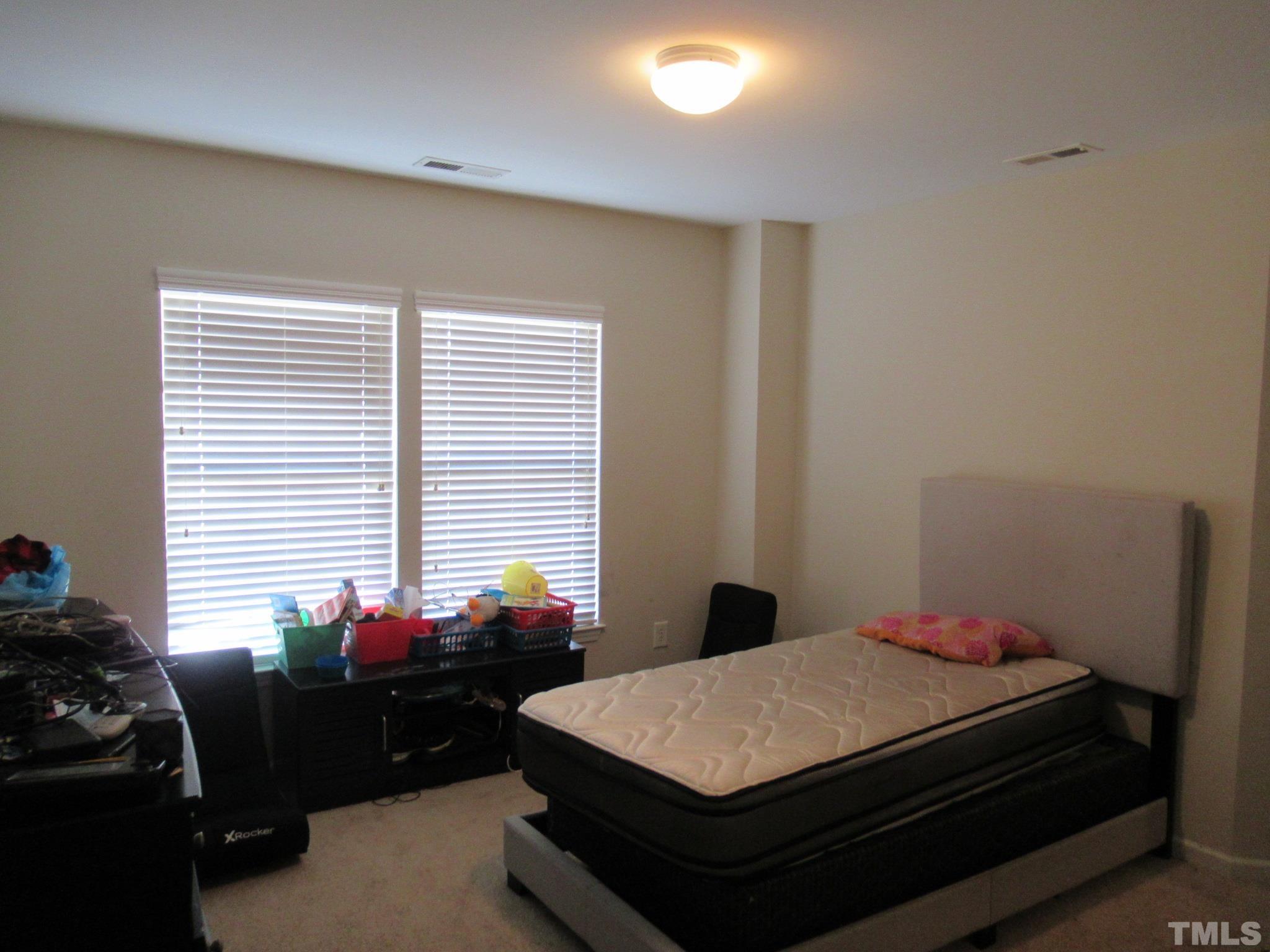 541 Ashgreen Court Rolesville, NC 27571 - Photo 10 of 15 a room with a bed and a window