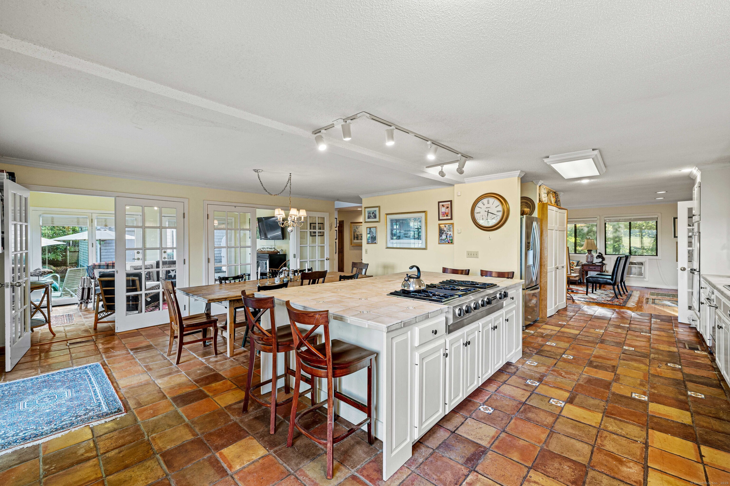 96 Ayers Point Road Old Saybrook, CT 06475 - Photo 16 of 39 a kitchen with a dining table and chairs