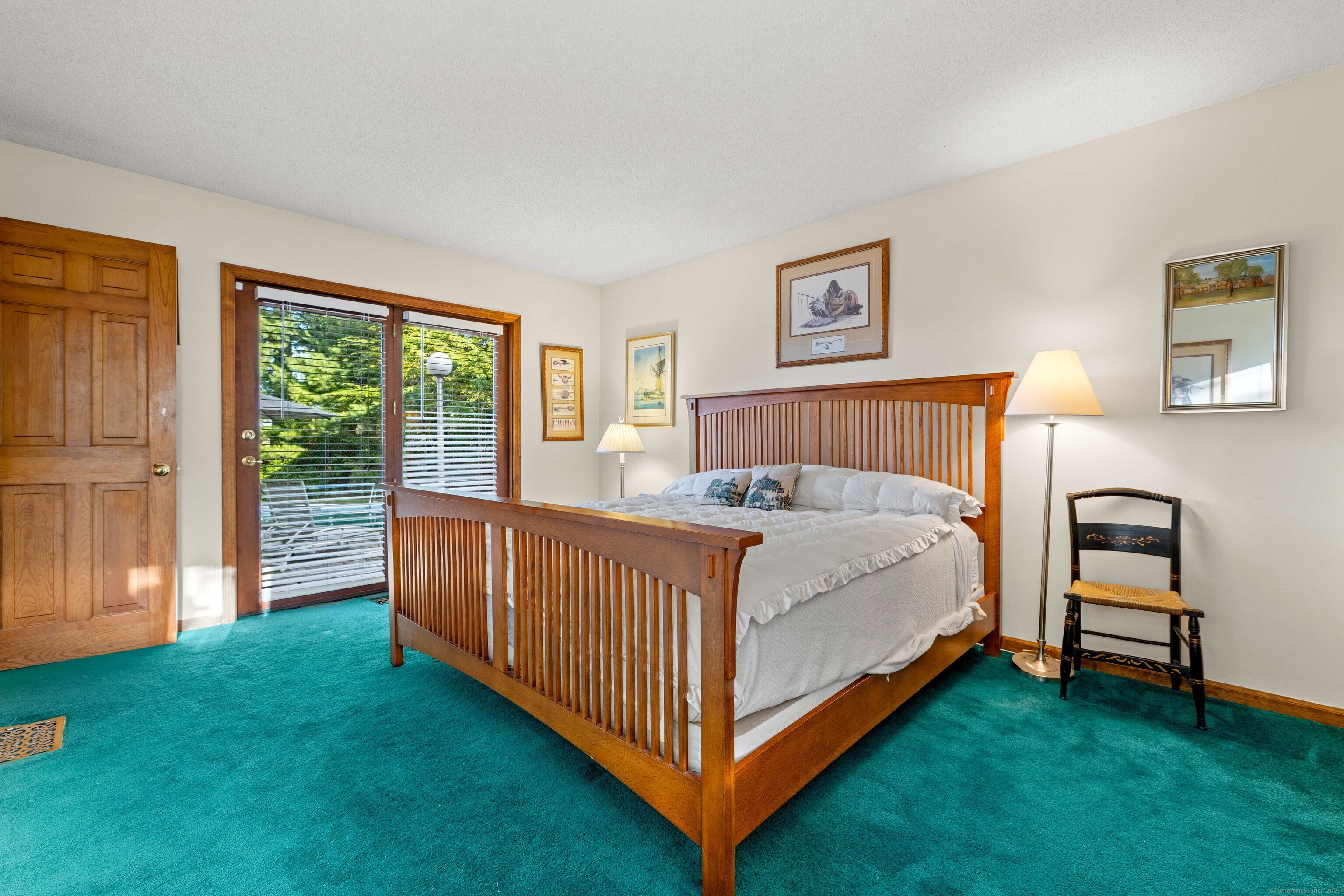 96 Ayers Point Road Old Saybrook, CT 06475 - Photo 23 of 39 a bed sitting in a spacious bedroom next to a window