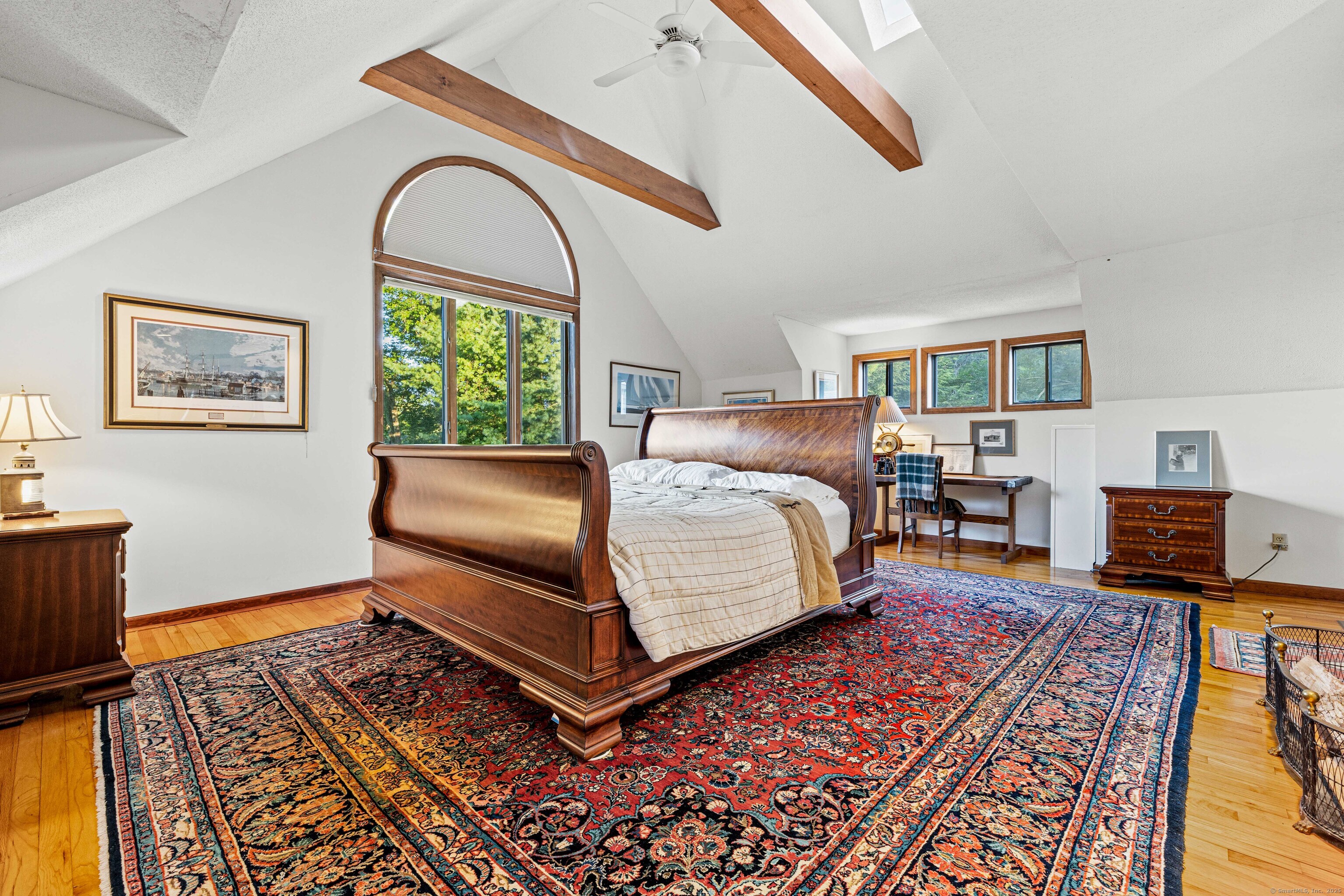 96 Ayers Point Road Old Saybrook, CT 06475 - Photo 27 of 39 a bedroom with a bed and wooden floor