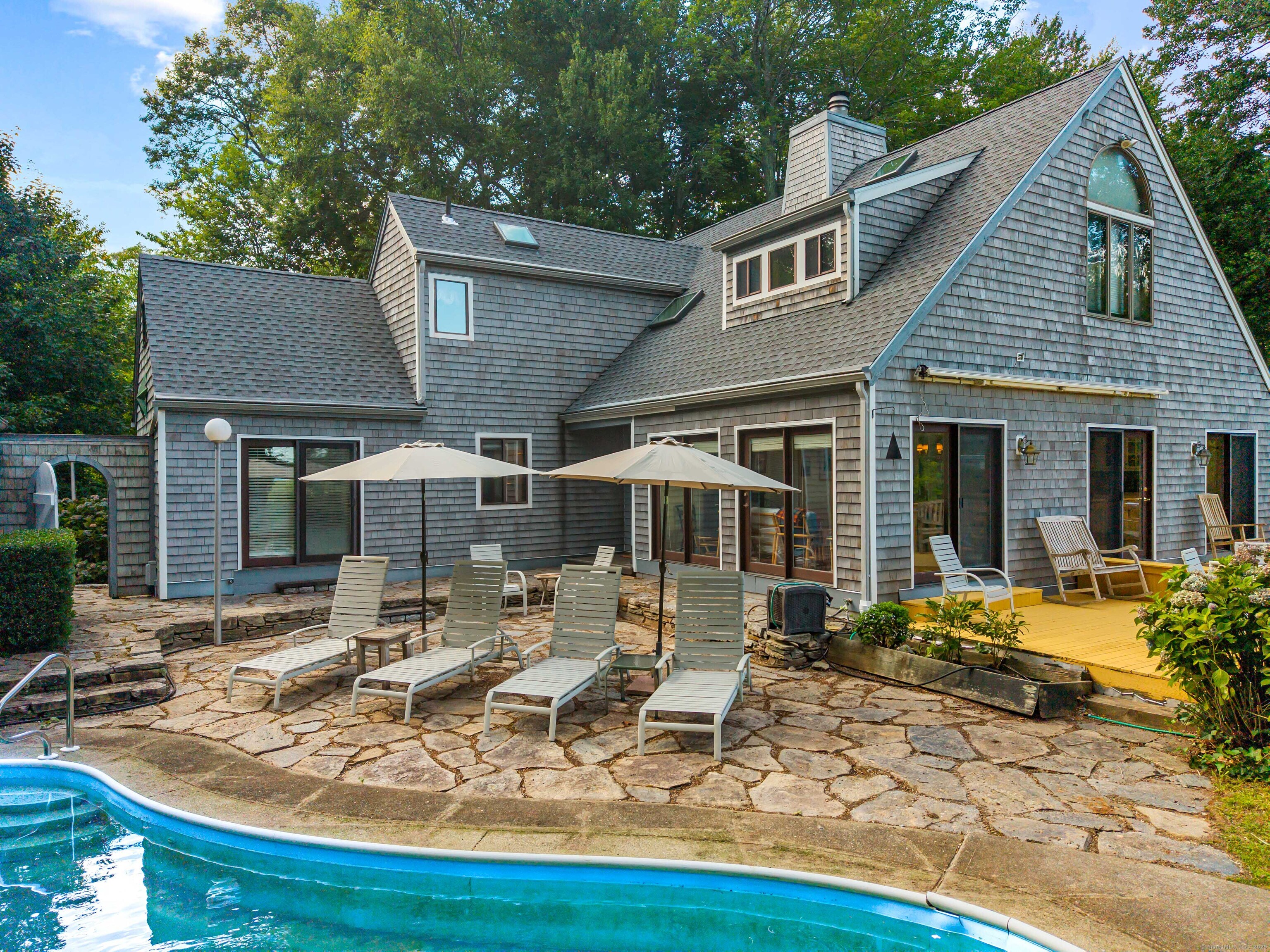 96 Ayers Point Road Old Saybrook, CT 06475 - Photo 3 of 39 a front view of house with yard outdoor seating and barbeque oven
