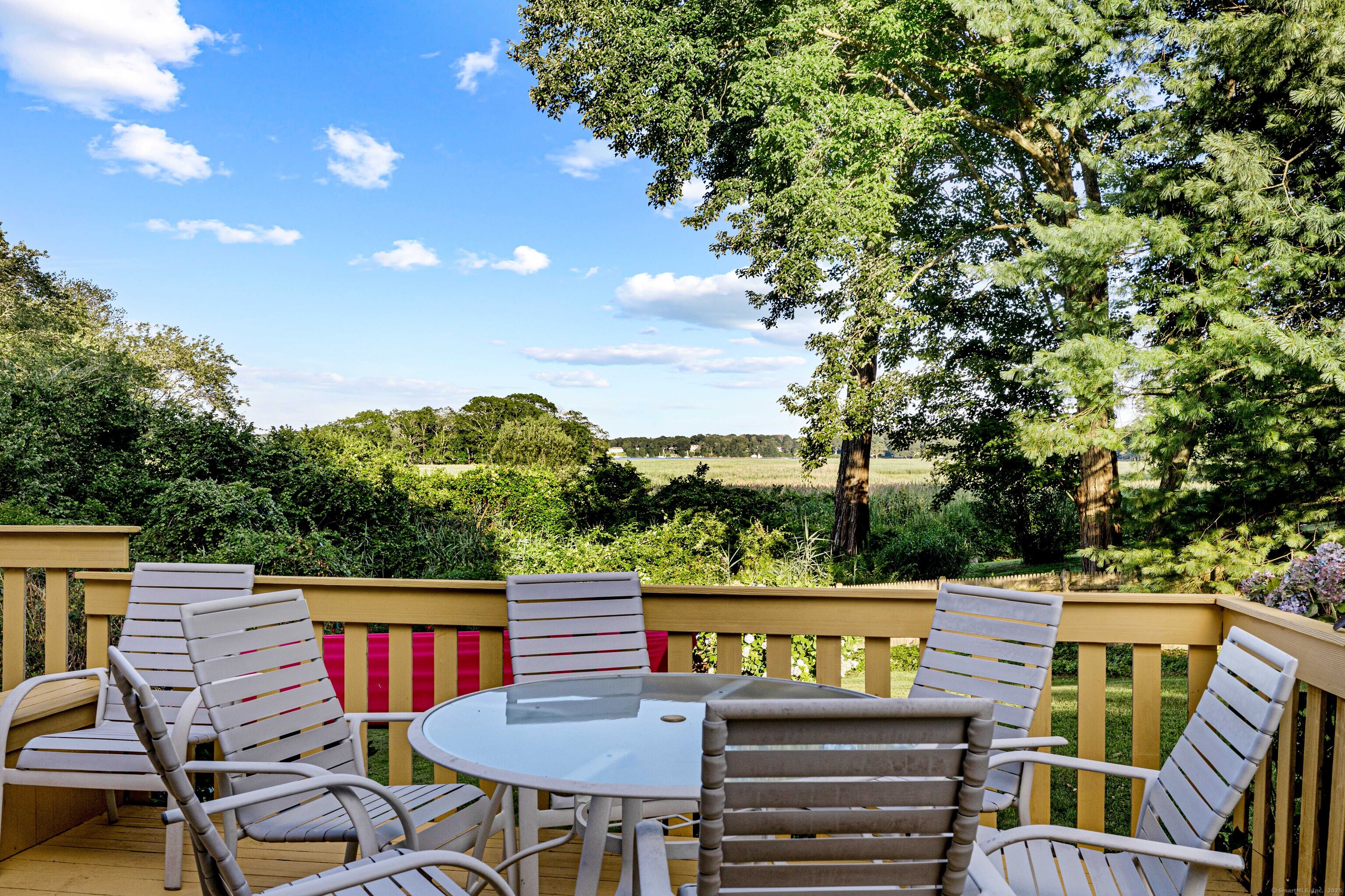 96 Ayers Point Road Old Saybrook, CT 06475 - Photo 33 of 39 a view of a chairs and table on the deck