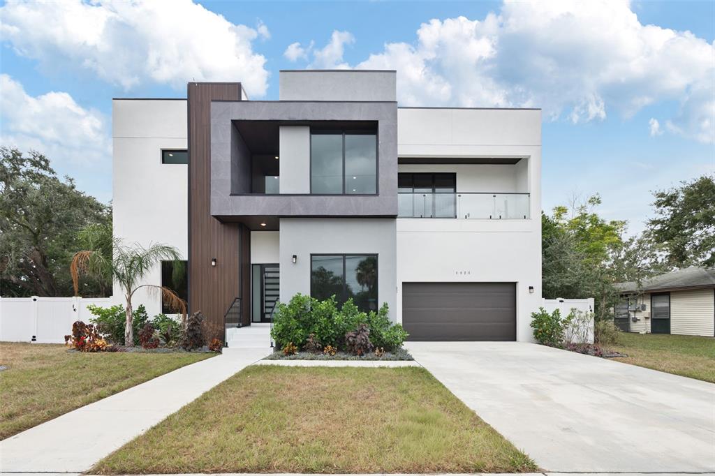 a front view of a house with yard