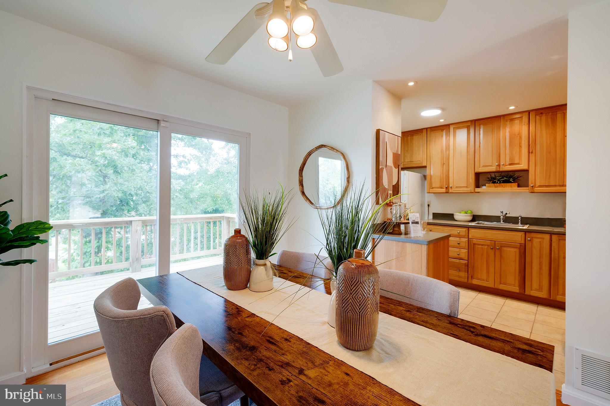 9212 Morley Road Lanham, MD 20706 - Photo 14 of 64 a living room with furniture a large window and a dining table