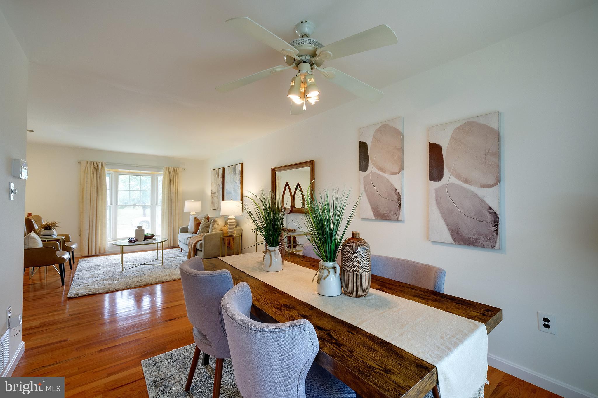 9212 Morley Road Lanham, MD 20706 - Photo 16 of 64 a dining room with furniture and wooden floor