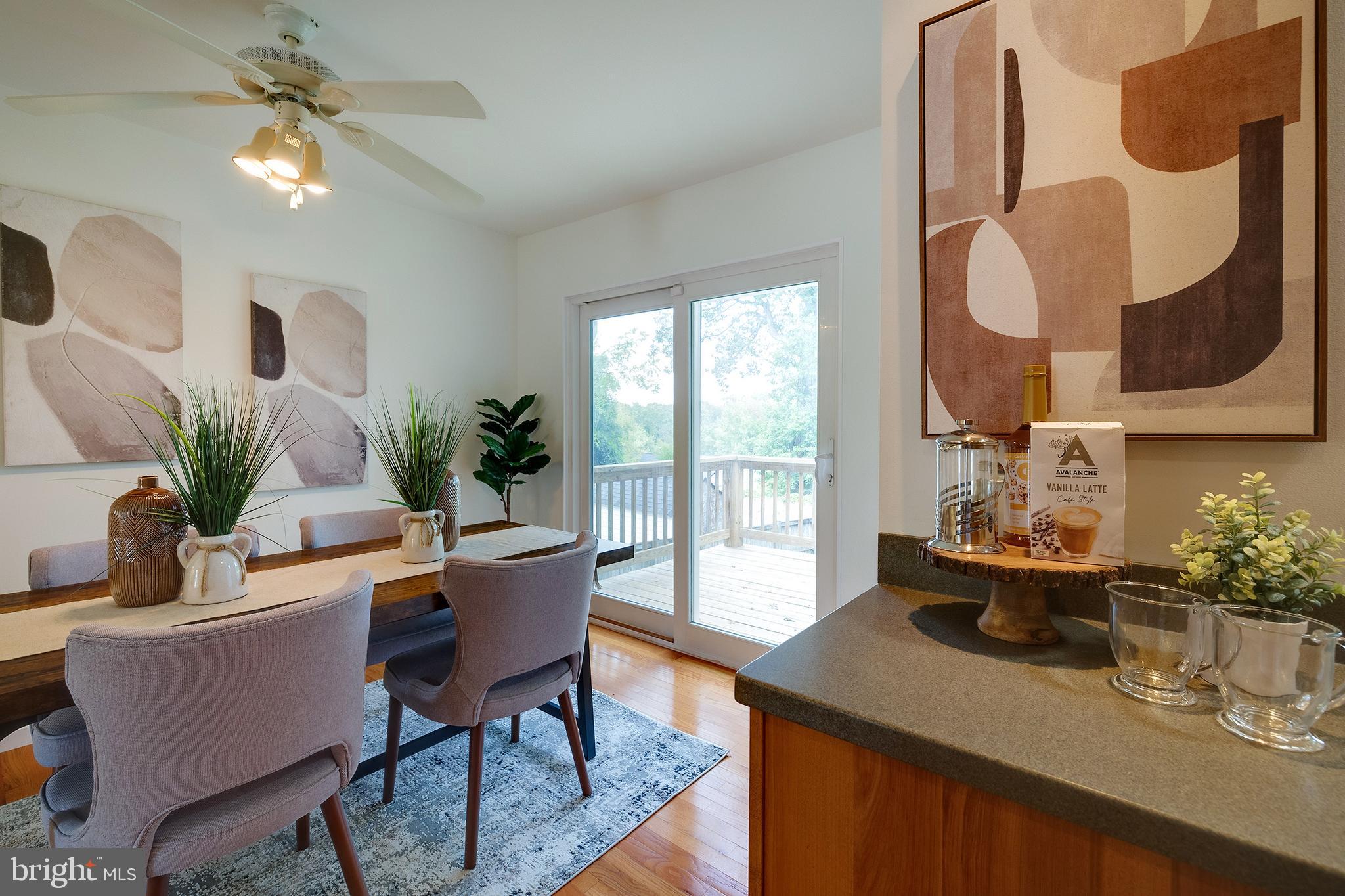 9212 Morley Road Lanham, MD 20706 - Photo 17 of 64 a dining room with furniture and wooden floor