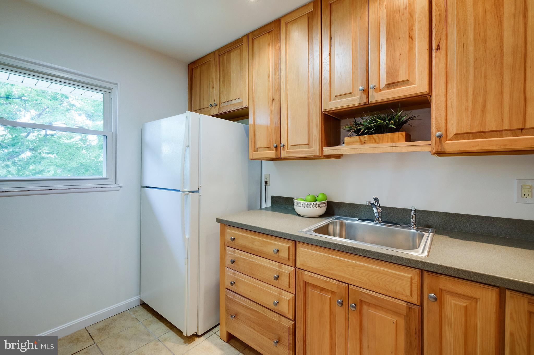 9212 Morley Road Lanham, MD 20706 - Photo 22 of 64 a kitchen with appliances a sink and cabinets