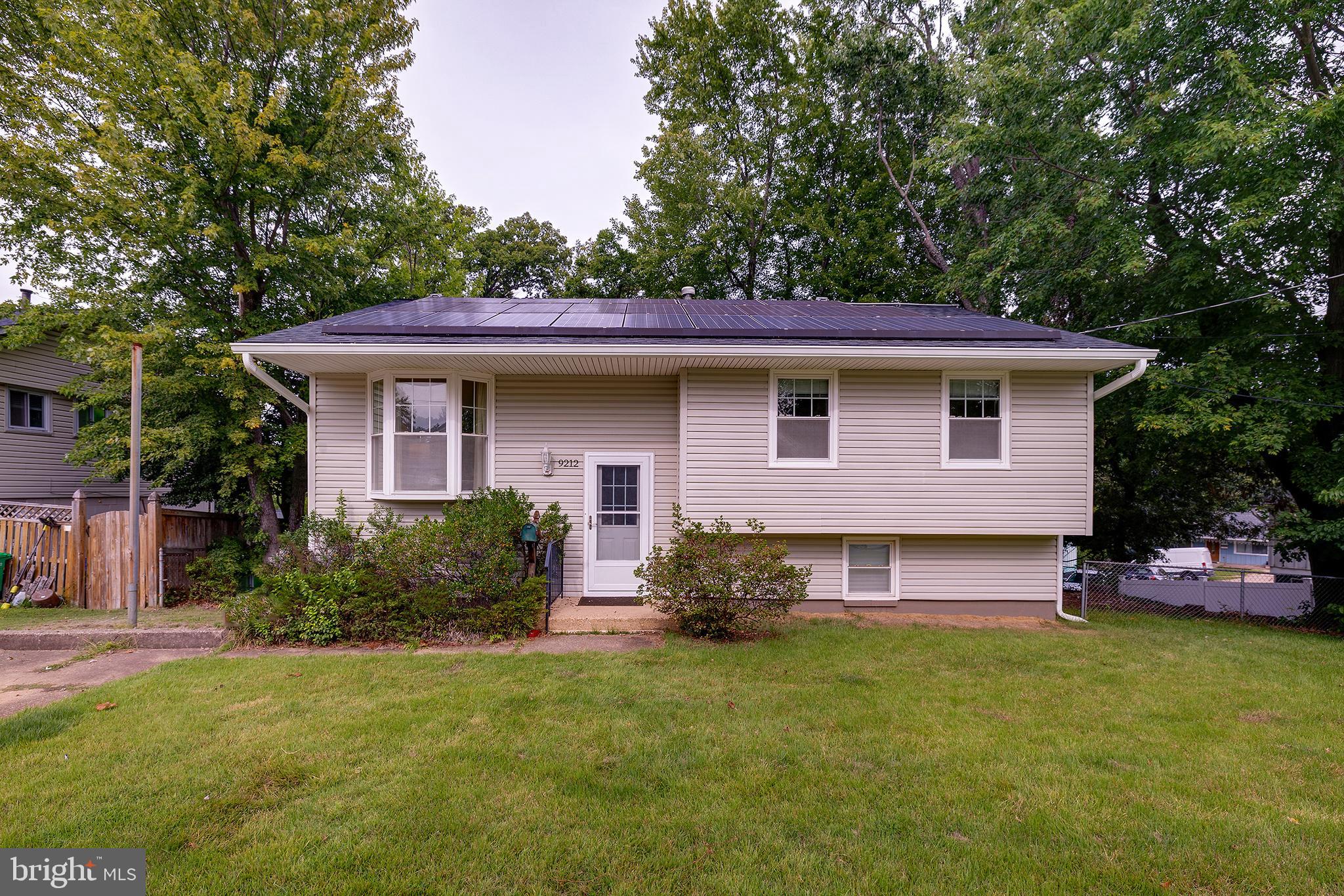 9212 Morley Road Lanham, MD 20706 - Photo 3 of 64 a front view of a house with a garden