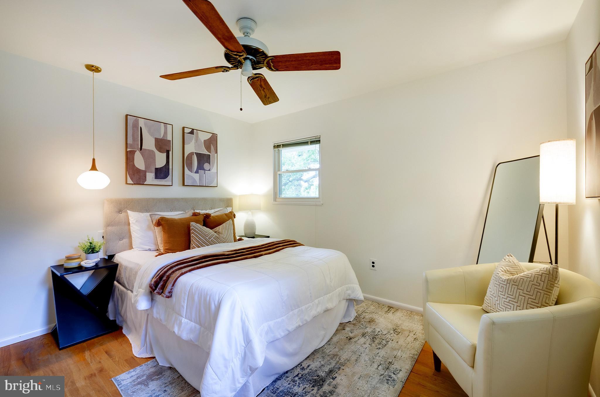 9212 Morley Road Lanham, MD 20706 - Photo 34 of 64 a bedroom with a bed and couch