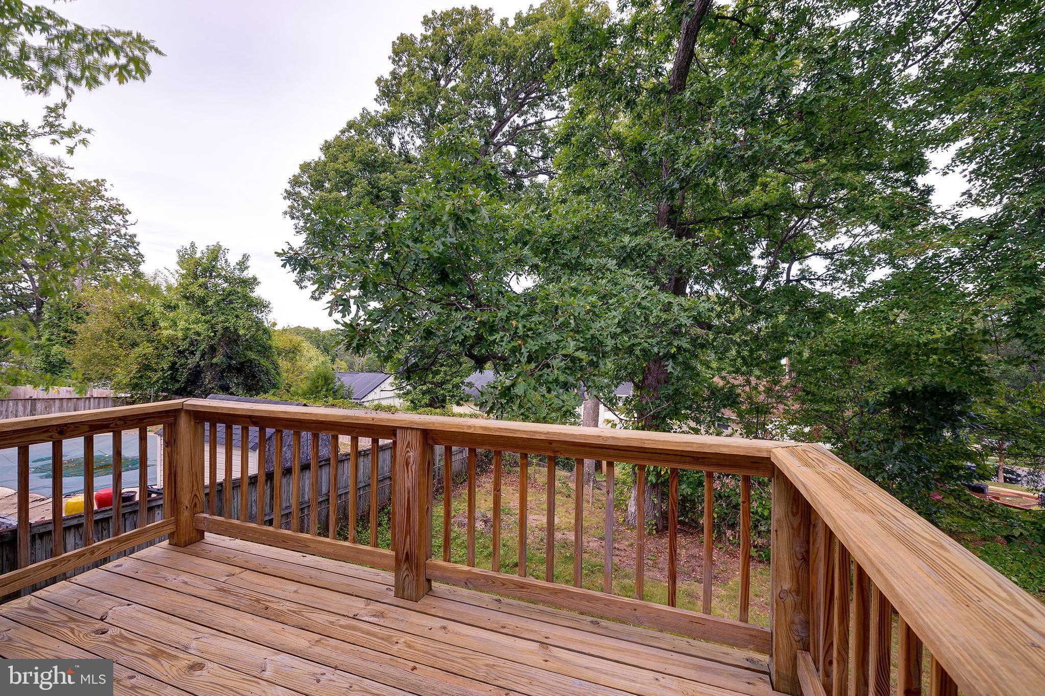 9212 Morley Road Lanham, MD 20706 - Photo 45 of 64 a view of balcony with wooden floor and fence