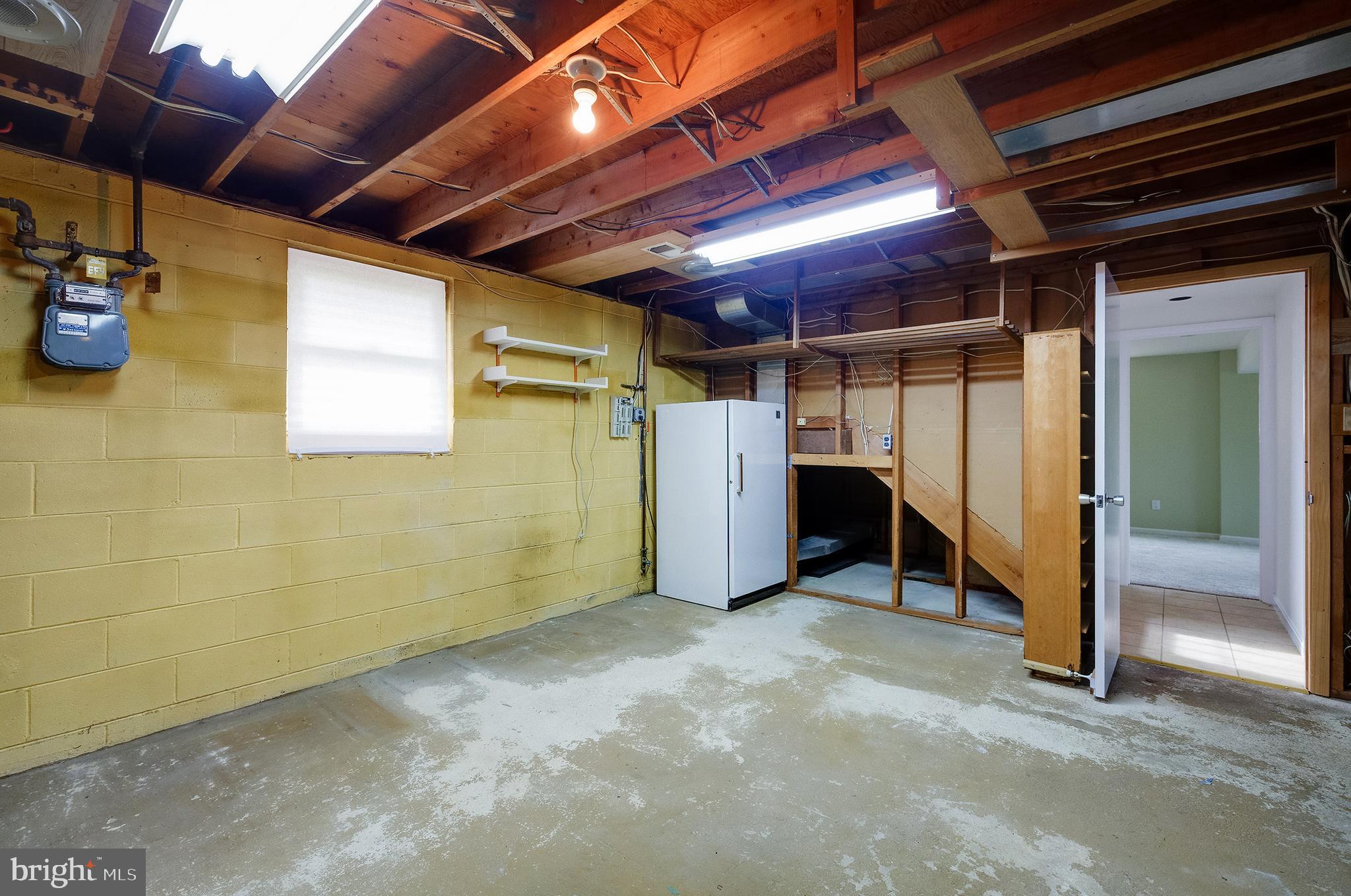 9212 Morley Road Lanham, MD 20706 - Photo 51 of 64 a view of empty room with wooden ceiling