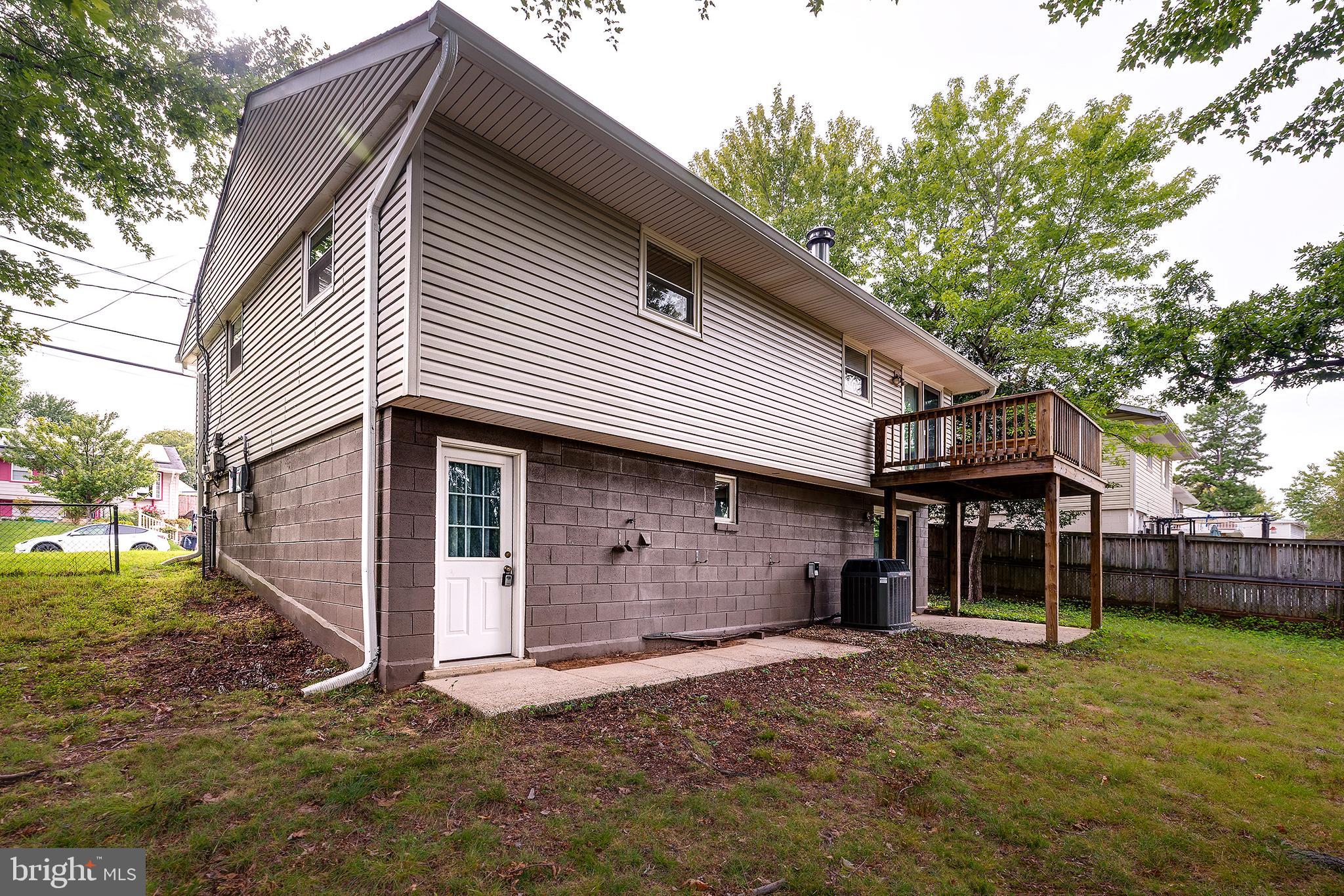 9212 Morley Road Lanham, MD 20706 - Photo 58 of 64 a front view of a house with a yard