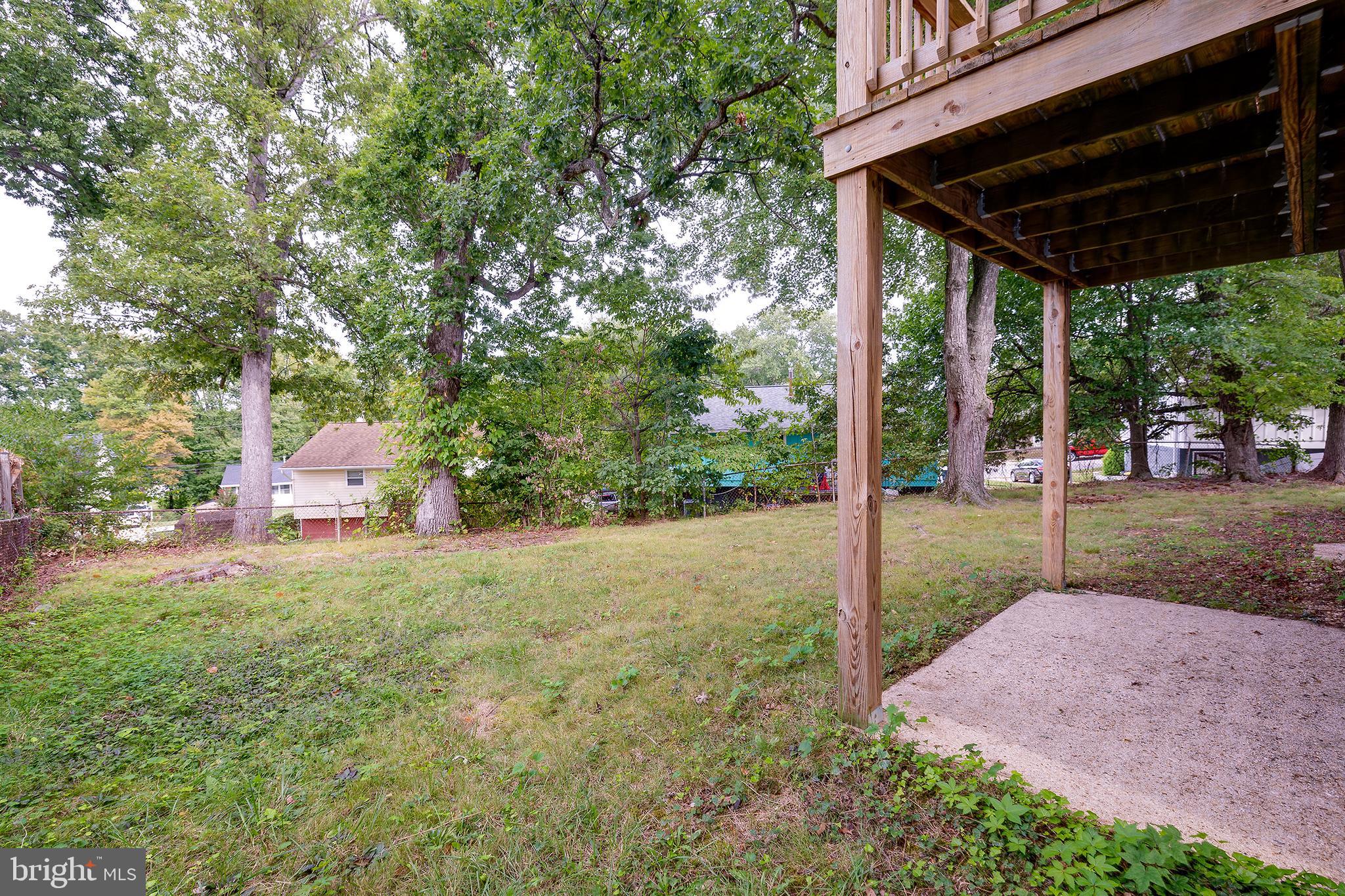 9212 Morley Road Lanham, MD 20706 - Photo 63 of 64 a backyard of a house with a garden and barbeque oven