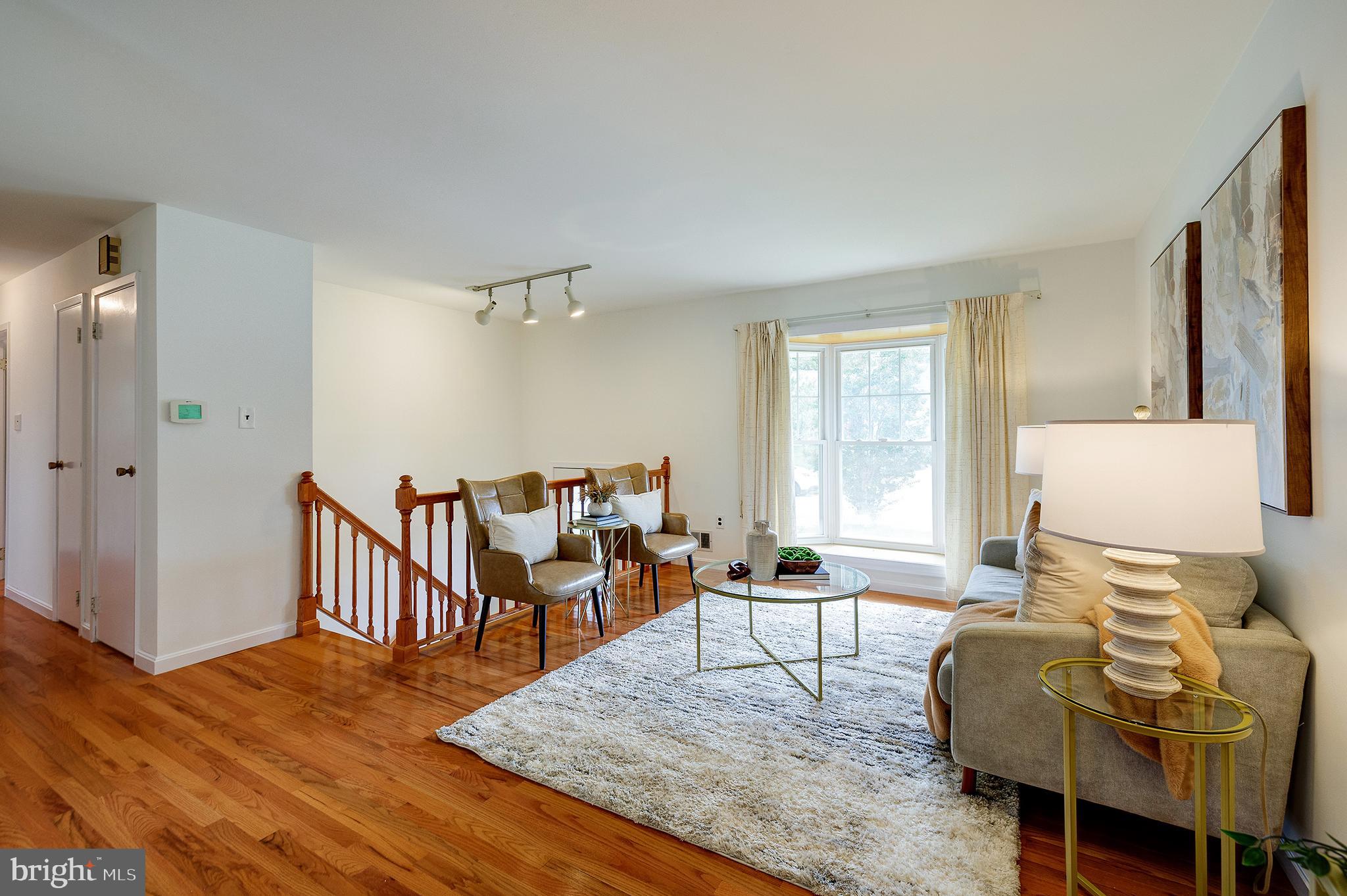 9212 Morley Road Lanham, MD 20706 - Photo 7 of 64 a living room with furniture wooden floor and a window