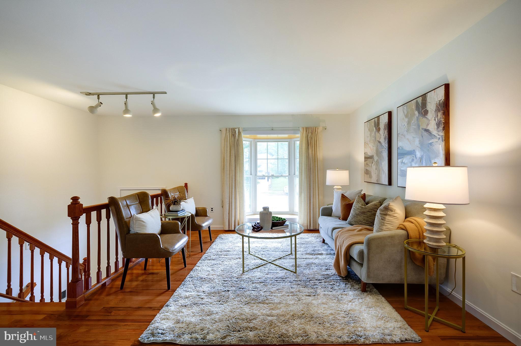 9212 Morley Road Lanham, MD 20706 - Photo 9 of 64 a living room with furniture and a table