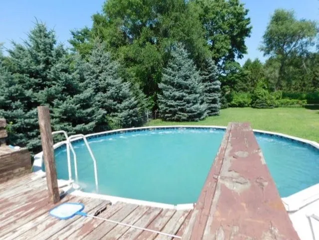 a view of a swimming pool with a patio