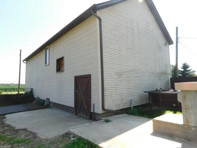 a view of a back yard of the house