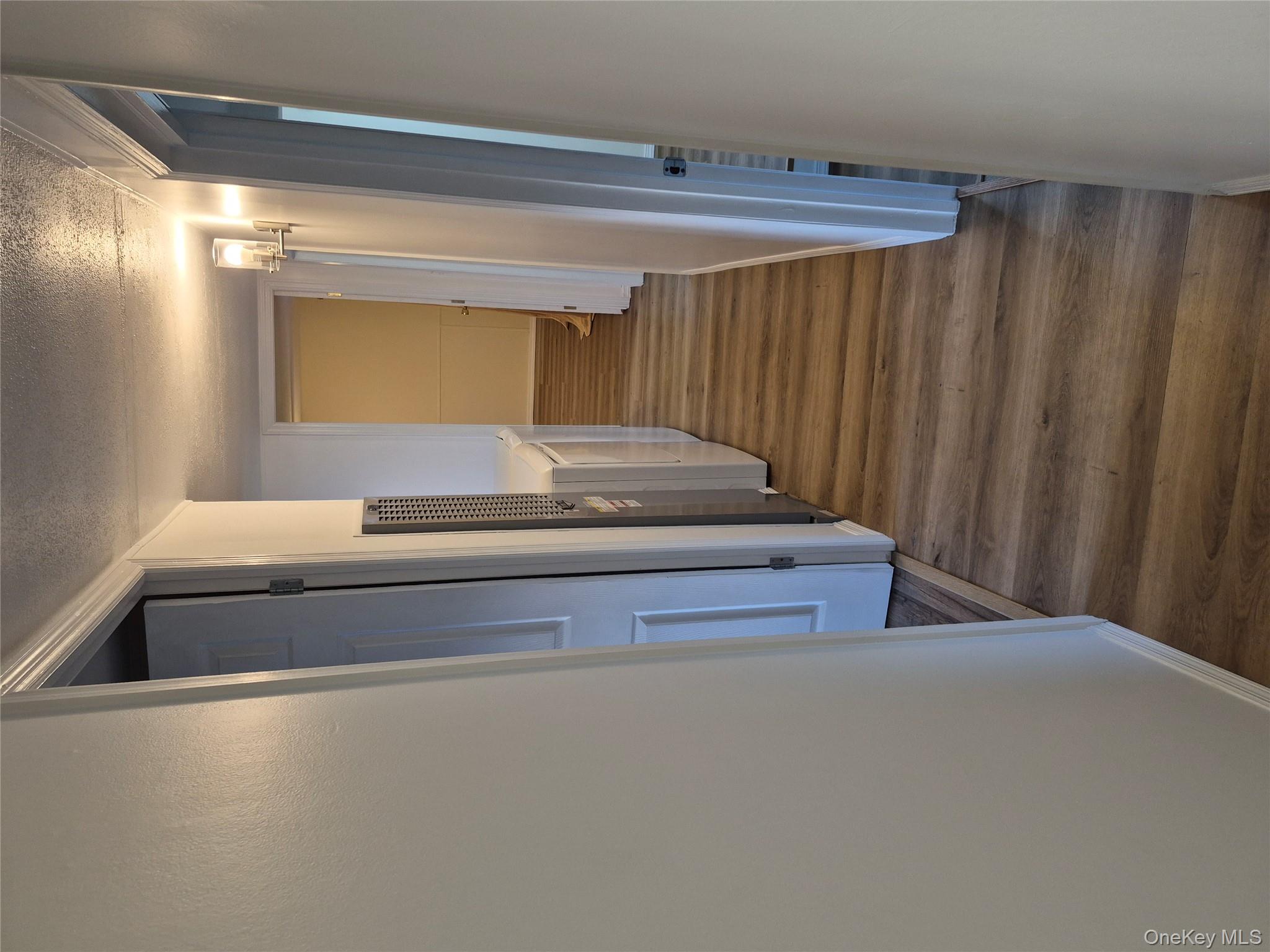 363 Mettacahonts Road, Unit 5 Accord, NY 12404 - Photo 18 of 39 a view of a hallway with wooden floor and entryway