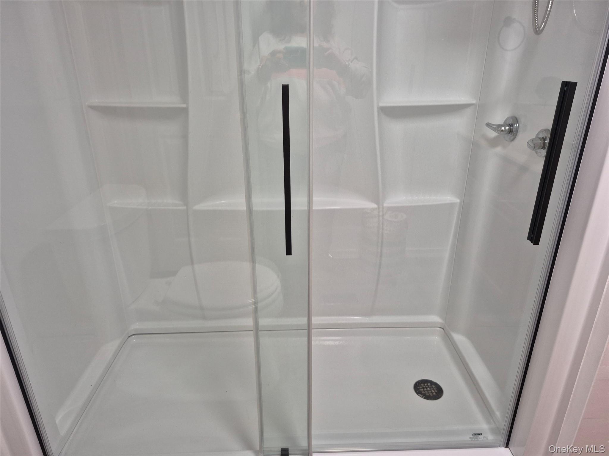 363 Mettacahonts Road, Unit 5 Accord, NY 12404 - Photo 25 of 39 a bathroom with a glass shower door