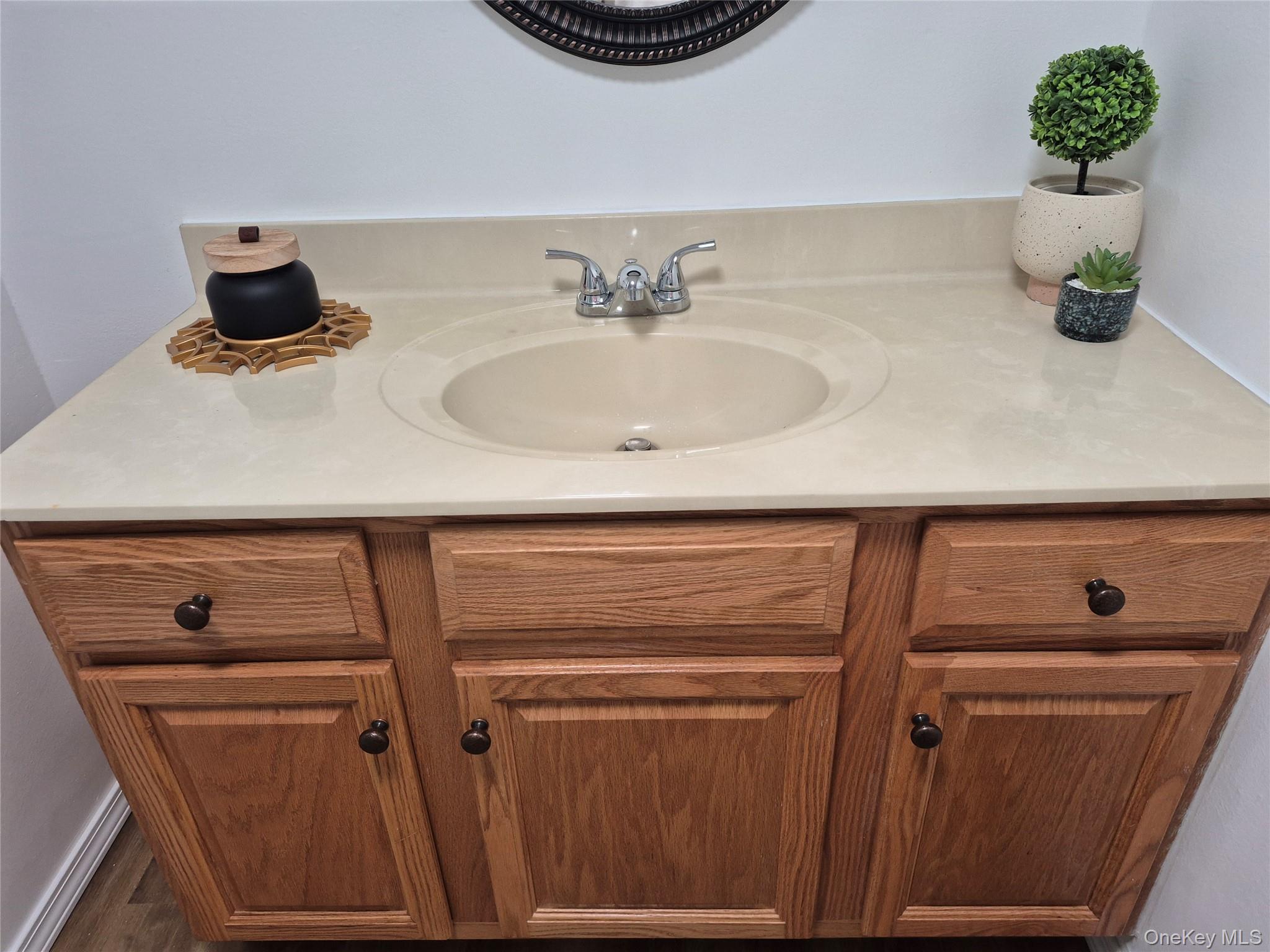 363 Mettacahonts Road, Unit 5 Accord, NY 12404 - Photo 26 of 39 a bathroom with a sink and a mirror