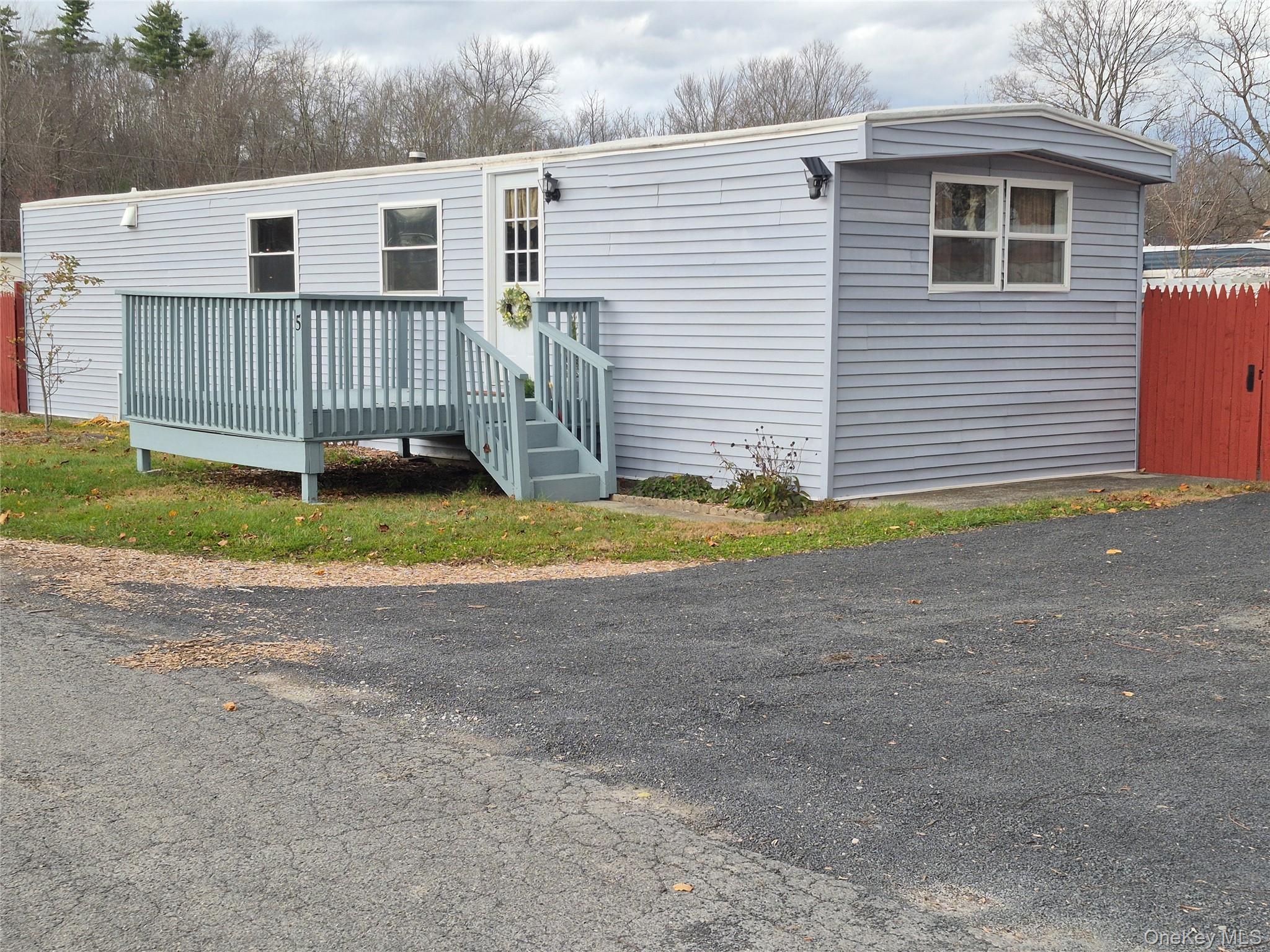 363 Mettacahonts Road, Unit 5 Accord, NY 12404 - Photo 8 of 39 a view of a house with a yard and fence
