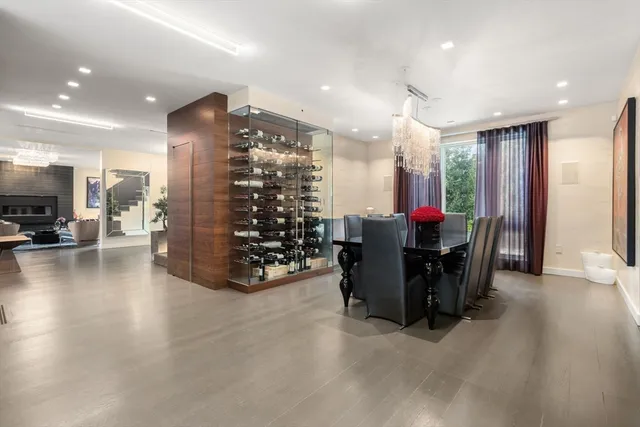 a view of a dining room with furniture and a chandelier