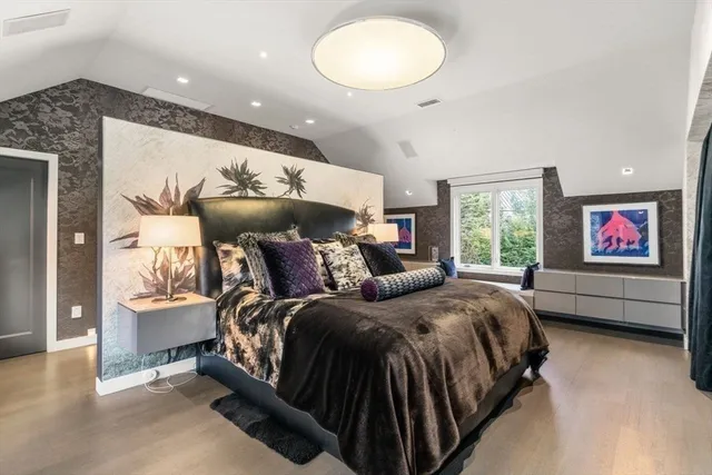 a spacious bedroom with a bed and window