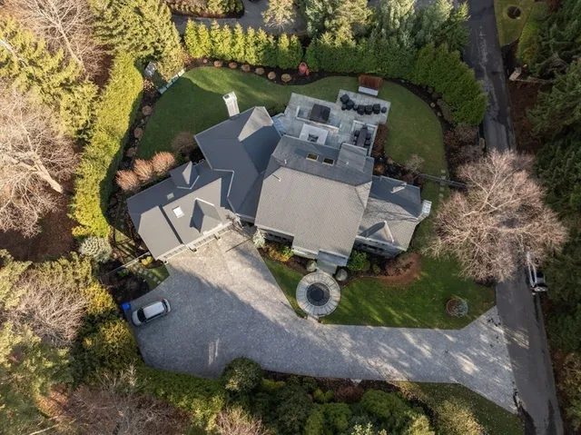 an aerial view of a house with outdoor space