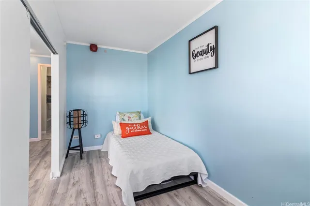 a view of kitchen with cabinets and refrigerator