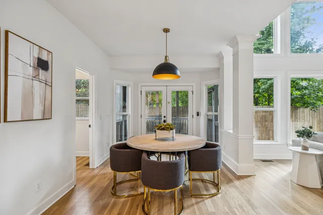 a large kitchen with a table and chairs
