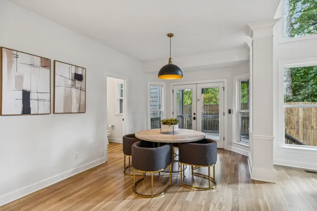 a kitchen with granite countertop white cabinets and stainless steel appliances