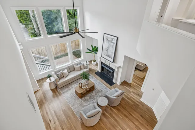 a view of a porch with furniture and fireplace