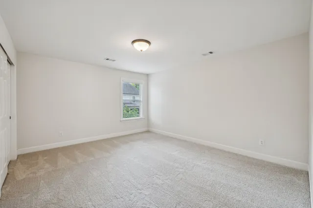 a view of backyard with wooden fences