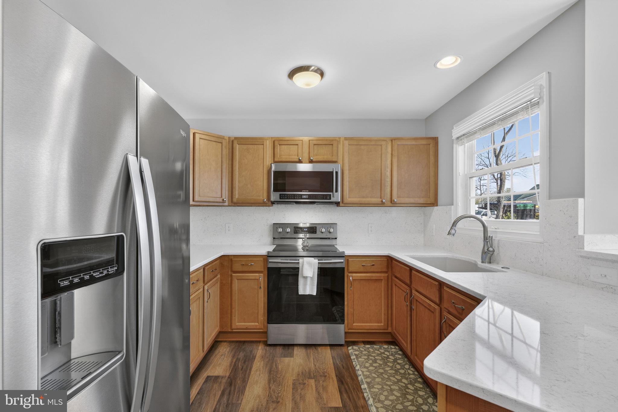 19707 Old Orange Road Culpeper, VA 22701 - Photo 13 of 40 a kitchen with stainless steel appliances granite countertop a refrigerator stove and sink