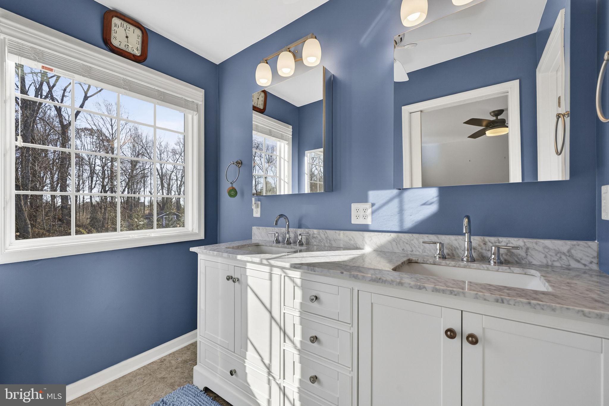 19707 Old Orange Road Culpeper, VA 22701 - Photo 24 of 40 a bathroom with a granite countertop sink and a mirror