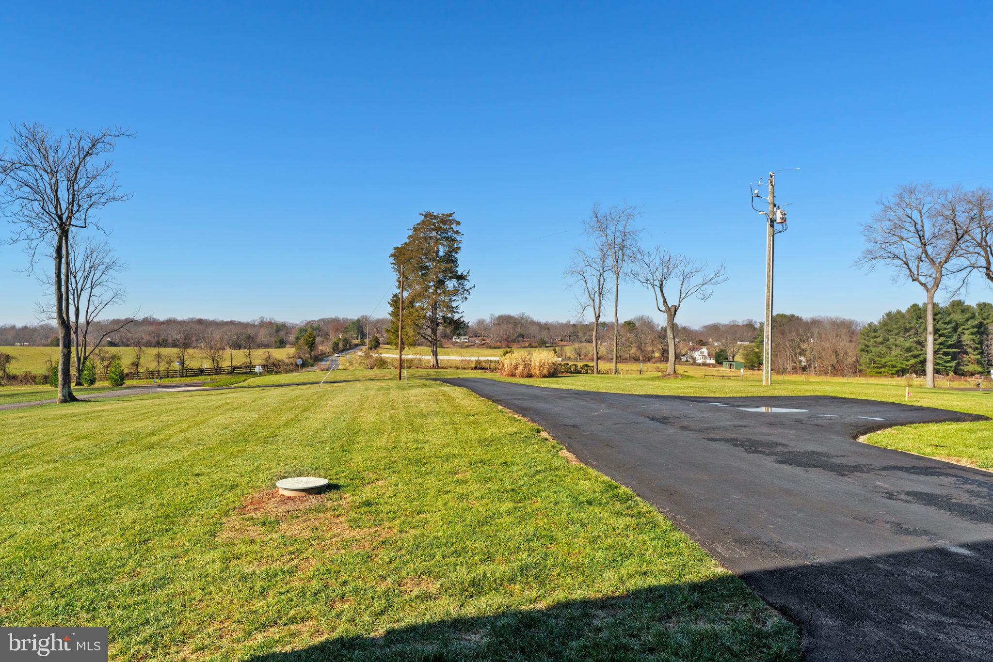 19707 Old Orange Road Culpeper, VA 22701 - Photo 3 of 40 a view of a swimming pool with an outdoor space and seating area