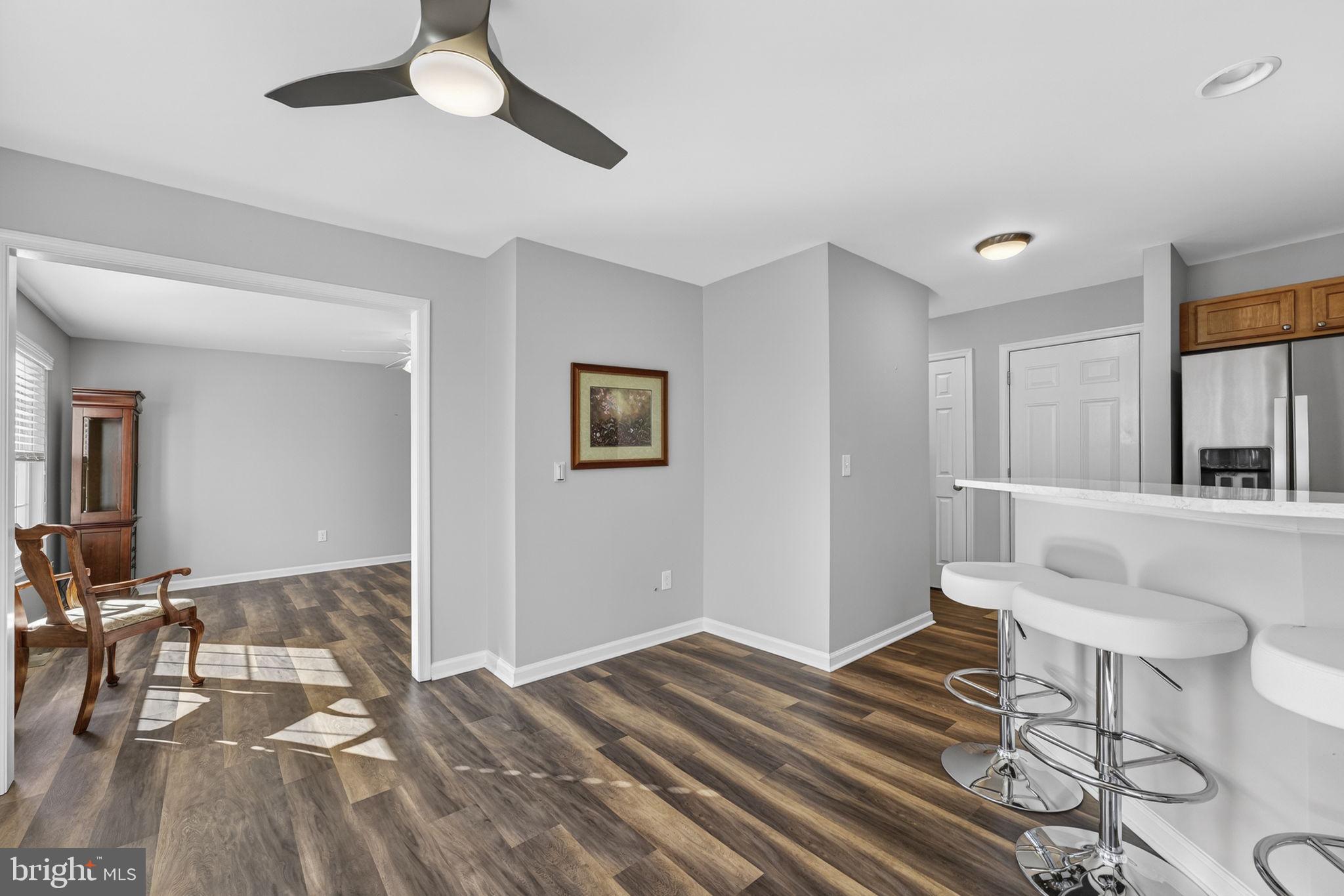 19707 Old Orange Road Culpeper, VA 22701 - Photo 5 of 40 a spacious bedroom with a bed and a table in it