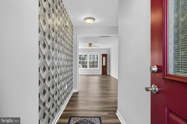a view of a hallway with windows