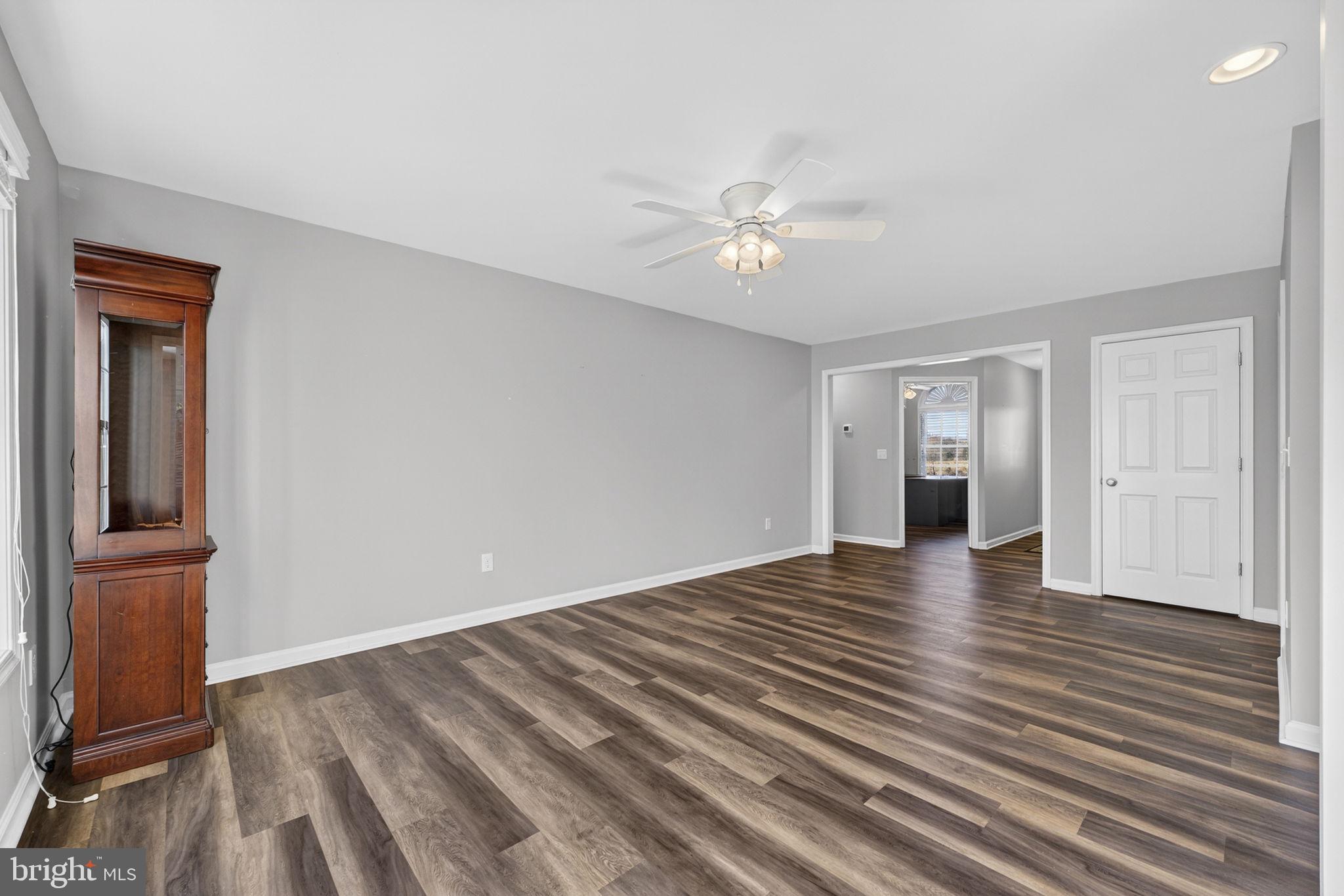 19707 Old Orange Road Culpeper, VA 22701 - Photo 8 of 40 a view of empty room with wooden floor and fan