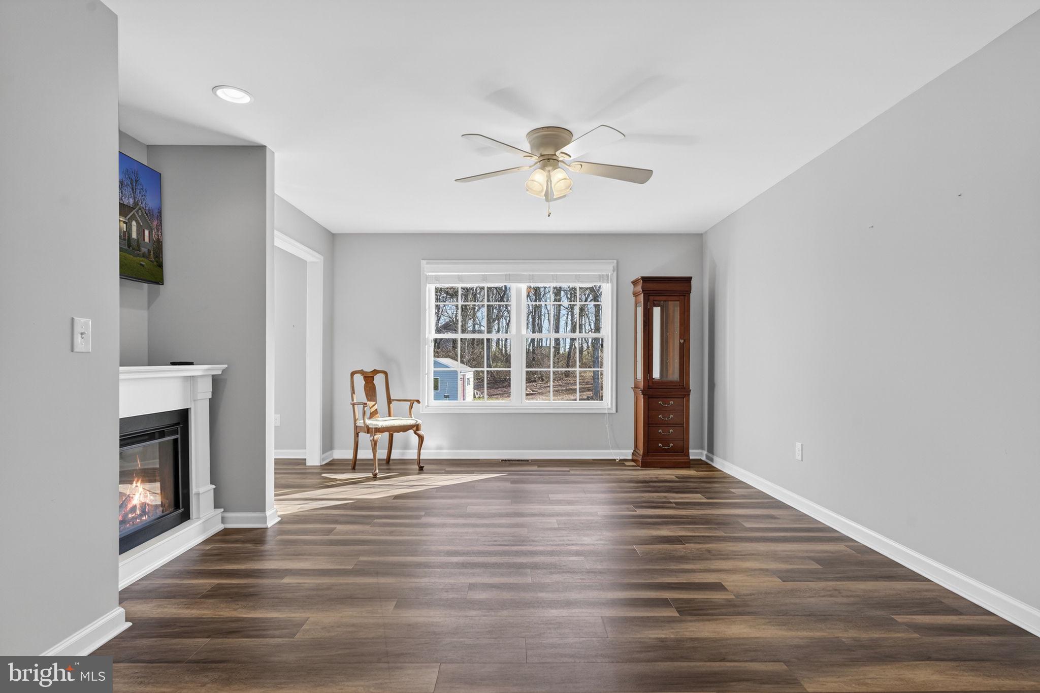 19707 Old Orange Road Culpeper, VA 22701 - Photo 10 of 40 a view of an empty room with wooden floor and a window