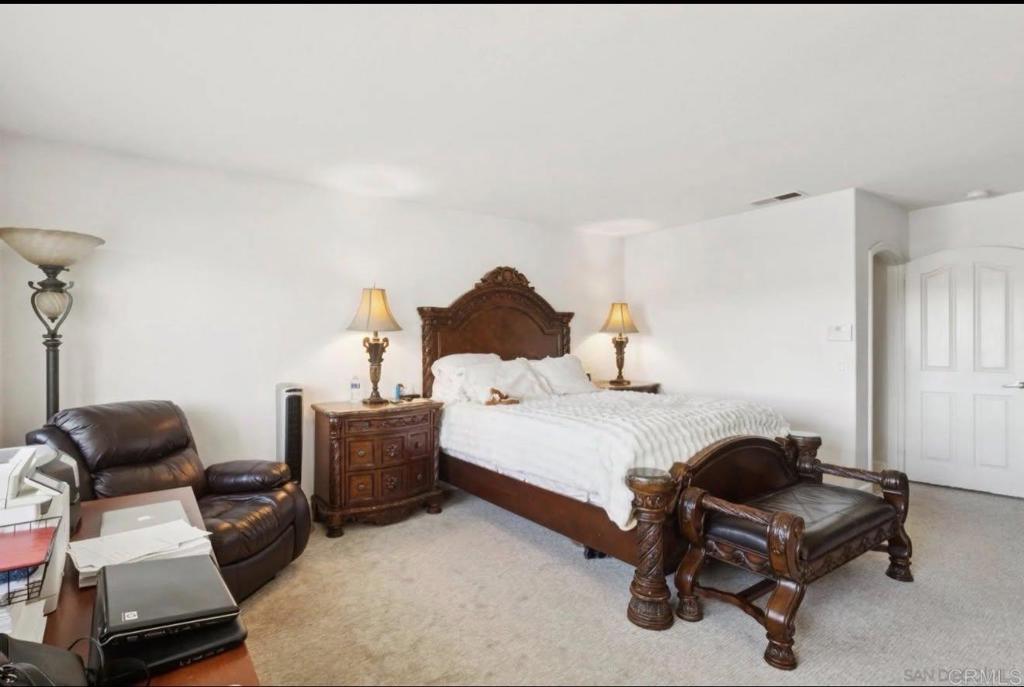 1234 Old Janal Ranch Road Chula Vista, CA 91915 - Photo 30 of 34 a bedroom with furniture and a couch