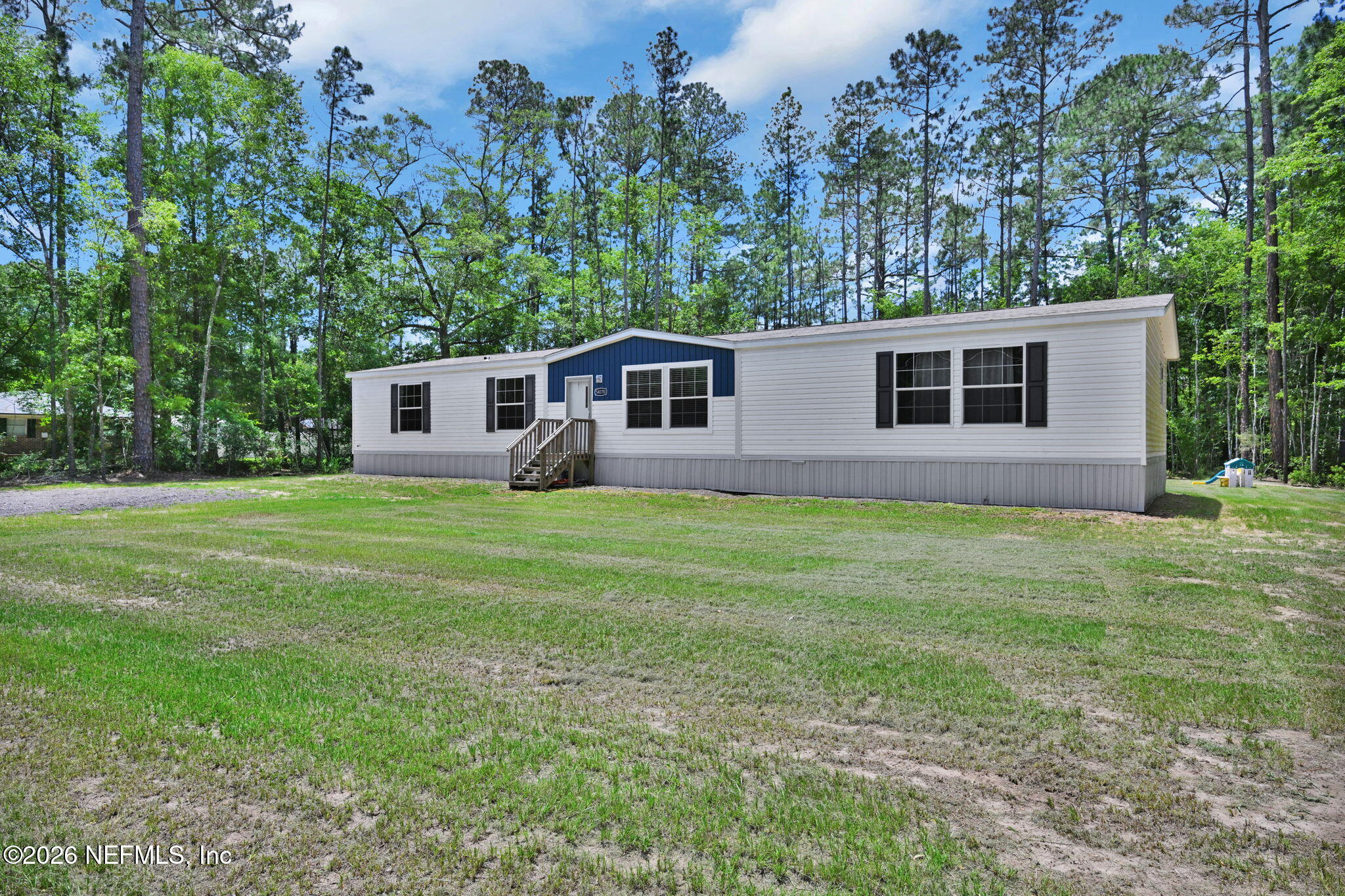 540783 Lem Turner Road Callahan, FL 32011 - Photo 4 of 36 a house that has a yard
