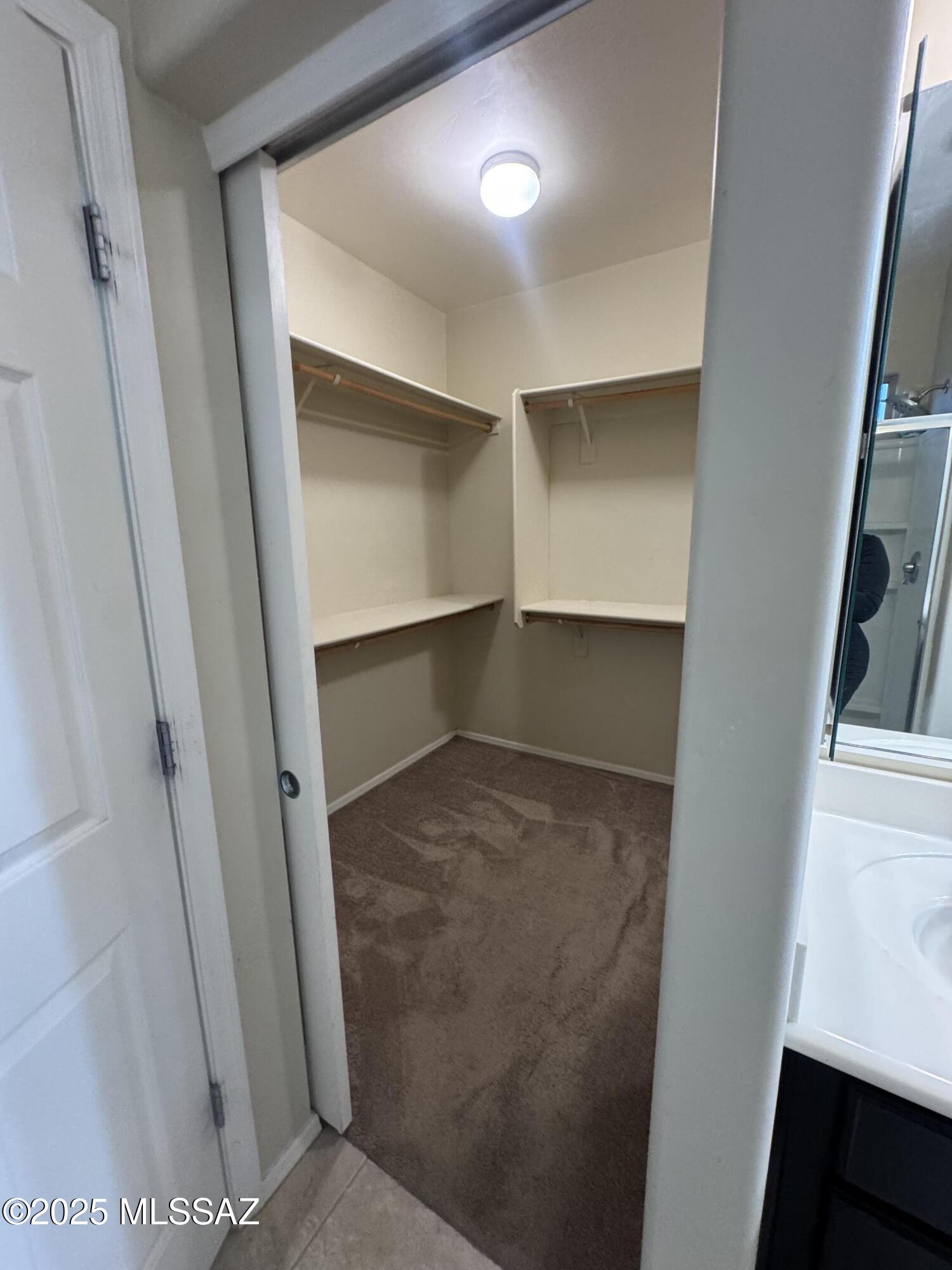 8697 West Denstone Road Marana, AZ 85653 - Photo 19 of 21 Primary closet with its own sliding door.