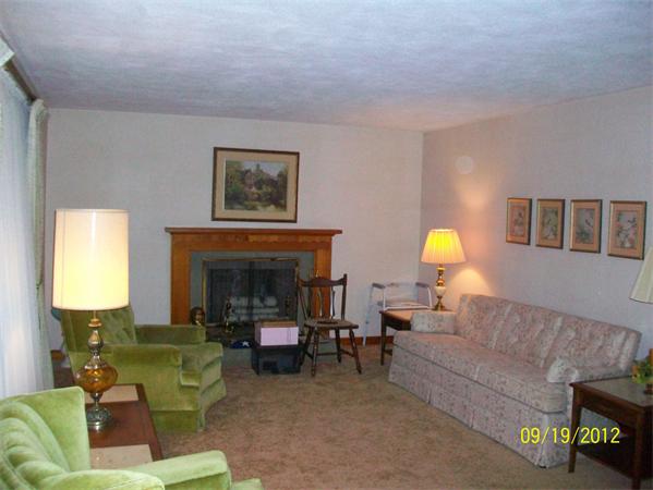 10 Senator Street Springfield, MA 01129 - Photo 11 of 21 a living room with furniture and a fireplace