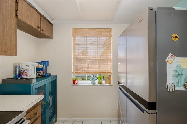 a kitchen with stainless steel appliances a refrigerator and a stove